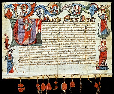 Zu sehen ist eine mittelalterliche Urkunde, reich an bunter Bemalung.